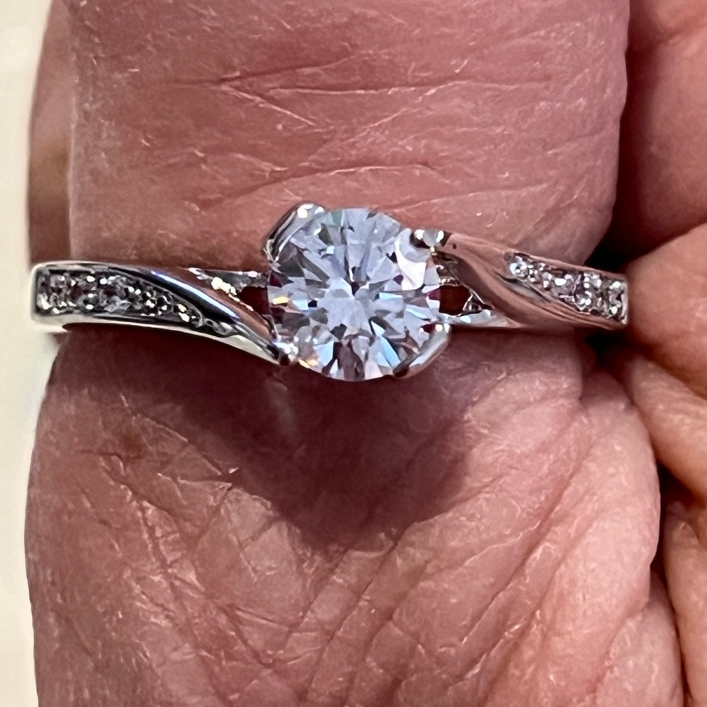 CZ, hand set platinum ring- size 9